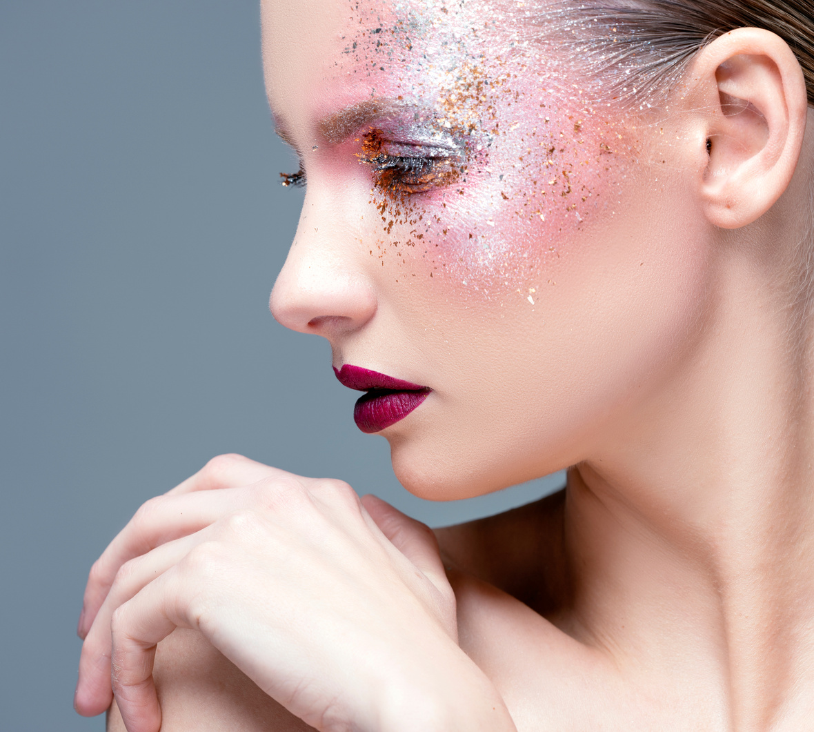 Beauty Portrait of Woman with Glitter Make-Up